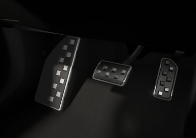 Sporty metal pedals inside the black Hyundai IONIQ 3 N Line interior.