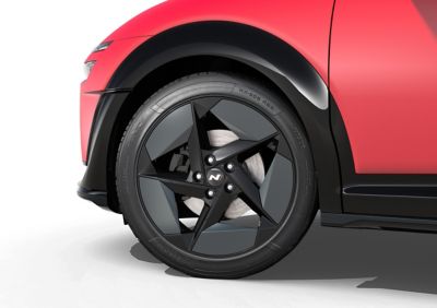 Close up view of the 19" N Line alloy wheel on a red Hyundai IONIQ 3 N Line.
