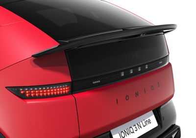Close up view of the black N Line spoiler on a red Hyundai IONIQ 3 N Line.
