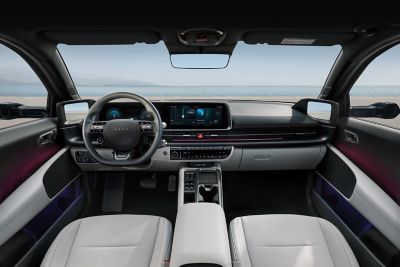 Interior of Hyundai IONIQ 5 cockpit showing the steering wheel, dashboard and both front seats.