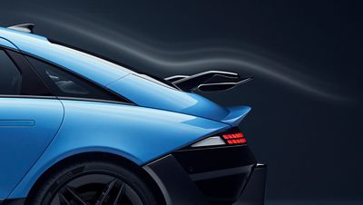 Hyundai IONIQ 6N rear side view highlighting wing spoiler and sleek aerodynamic design.