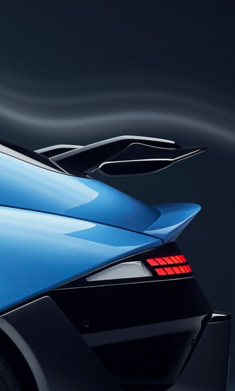 Hyundai IONIQ 6N rear side view highlighting wing spoiler and sleek aerodynamic design.