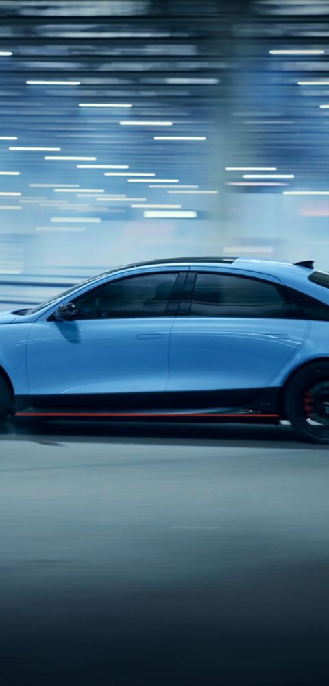 Hyundai IONIQ 6N captured in motion from the side, emphasising speed and aerodynamic efficiency.