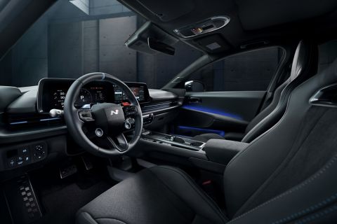 Interior view of the Hyundai IONIQ 6 N showing the cockpit, digital displays, and driver-oriented controls.