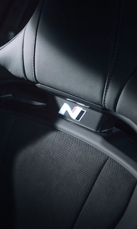 Close-up of the N logo on the sports bucket seat inside the Hyundai IONIQ 6 N.