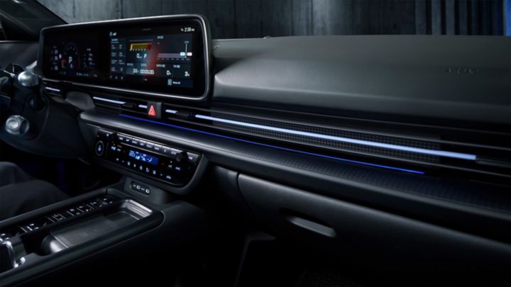 Close-up of the dashboard and ambient lighting system inside the Hyundai IONIQ 6 N, highlighting its sleek design.