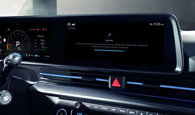 Hyundai IONIQ 6 N interior showing dual digital displays with over-the-air update progress screen.