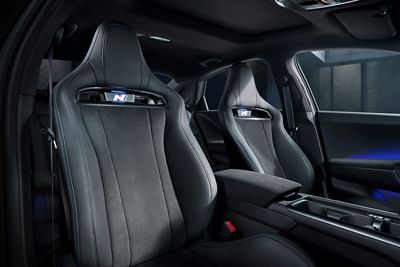 Front performance seats in the Hyundai IONIQ 6 N, featuring integrated N logos and a premium design.