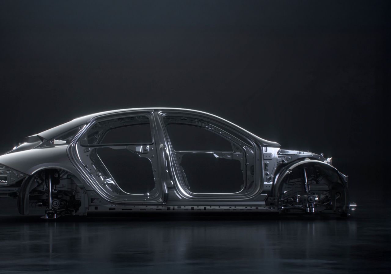 Side view of the Hyundai IONIQ 6 N's aerodynamic chassis construction highlighted against a dark background.