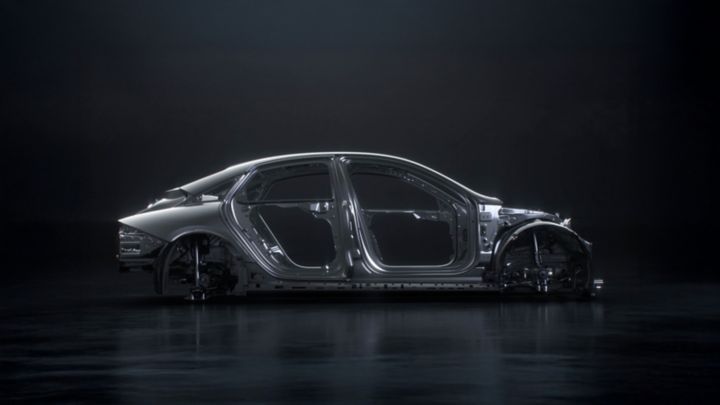 Side view of the Hyundai IONIQ 6 N's aerodynamic chassis construction highlighted against a dark background.