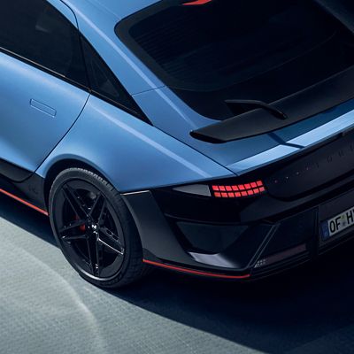 Top-down view of the rear of the Hyundai IONIQ 6 N, highlighting its sleek lines and prominent rear spoiler.