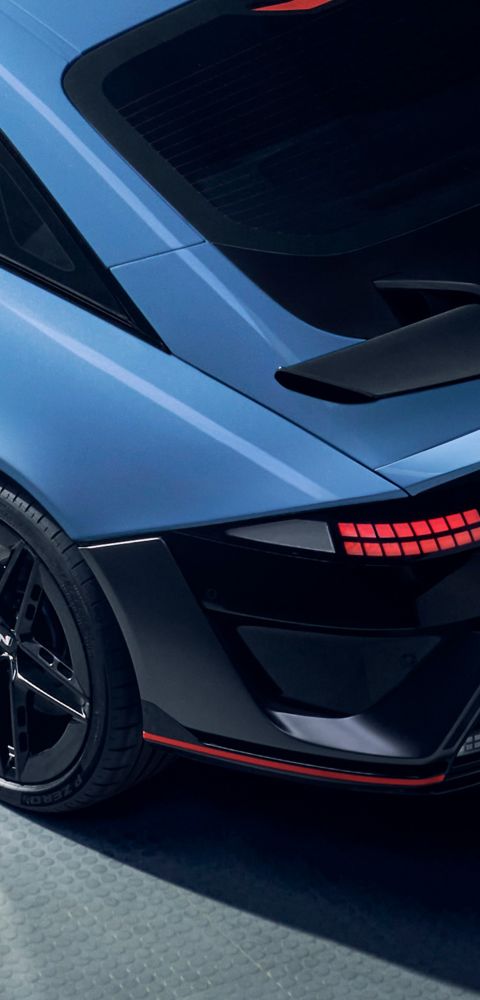 Top-down view of the rear of the Hyundai IONIQ 6 N, highlighting its sleek lines and prominent rear spoiler.