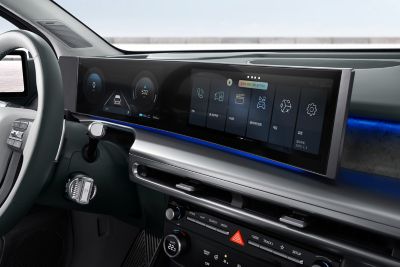 Curved panoramic display of the IONIQ 9 showing Hyundai AI Assistant.