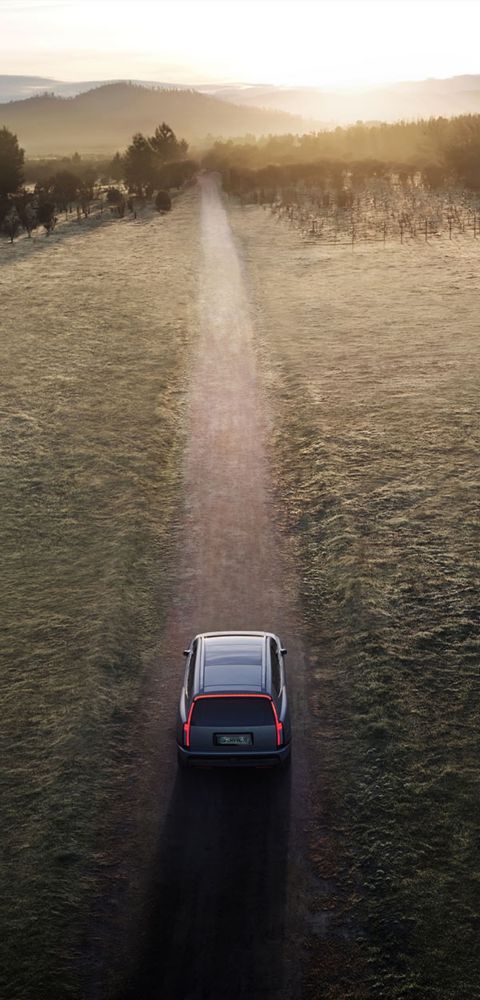 Hyundai IONIQ 9 electric SUV driving down a dirt road seen from above.