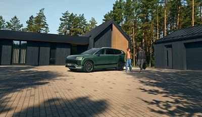 Hyundai IONIQ 9 electric SUV parked in front of a house.
