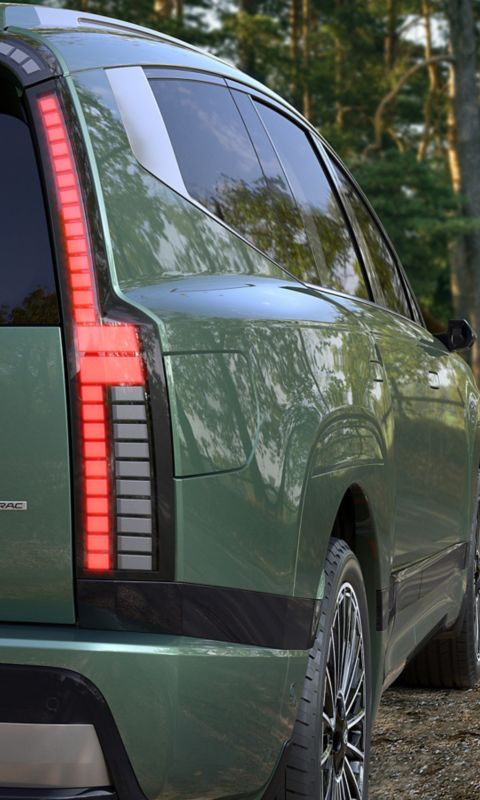 Hyundai IONIQ 9 parked near a lakeside path with a close view of the rear design.