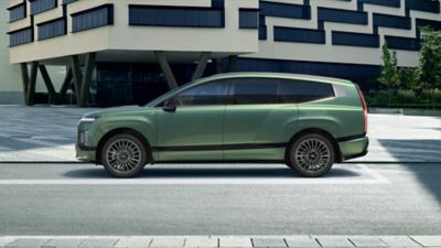 Side view of green Hyundai IONIQ 9 electric SUV.