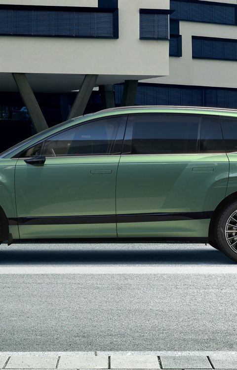 Side view of green Hyundai IONIQ 9 electric SUV.