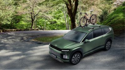 Hyundai IONIQ 9 with cross bars aluminium and bike carrier plus transport accessories.