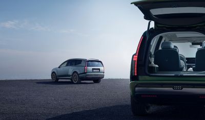 Two Hyundai IONIQ 9 electric SUV parked, one with an open tailgate.