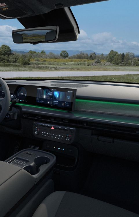 Interior of the Hyundai IONIQ 9 Calligraphy Black Ink cockpit showing the integrated displays and both front seats.