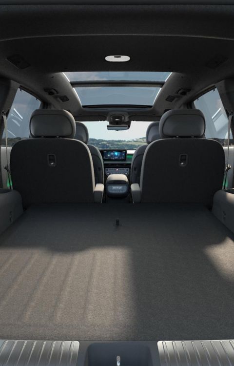2nd row relaxation seats fully reclined inside the Hyundai IONIQ 9 electric SUV Calligraphy Black Ink trim.