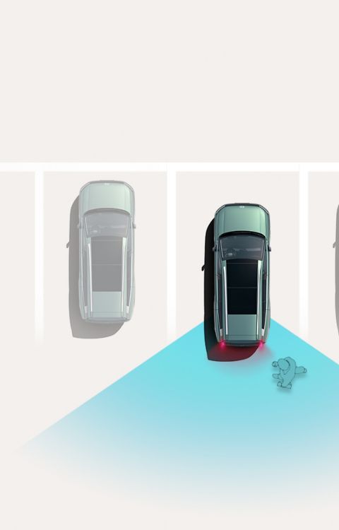 Reverse Parking Collision-Avoidance Assist: Overhead view of a Hyundai IONIQ 9 reversing into a parking space while sensors detect an obstacle behind the vehicle.