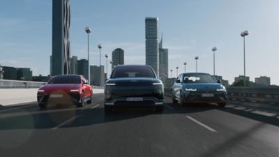 Image showing the IONIQ range driving on a motorway.