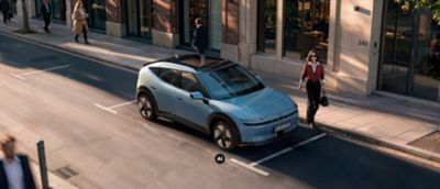 Hyundai IONIQ 3 exterior view on a city road.