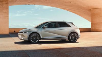 The new Hyundai Tucson, pictured from the front, shown standing on a moodily-lit street.