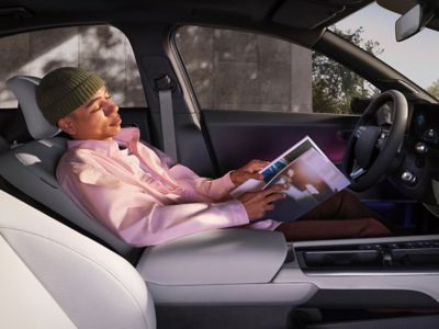 Hyundai IONIQ 6 interior showing a reclining relaxation seat inside a modern cabin.