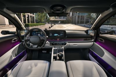 Cockpit of the Hyundai IONIQ 6 all-electric sedan with white seats.