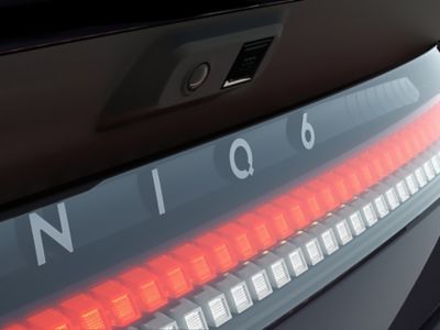 Close up shot of IONIQ 6 rear logo and illuminated Parametric Pixels on rear end.