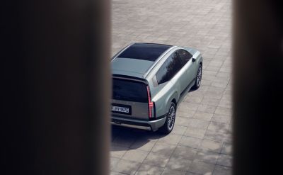 Hyundai IONIQ 9 seen from above while parked on an open paved area.