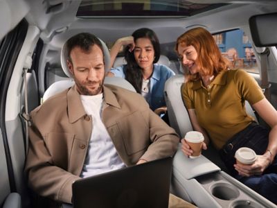 People enjoying the spacious interior of a Hyundai IONIQ 3.