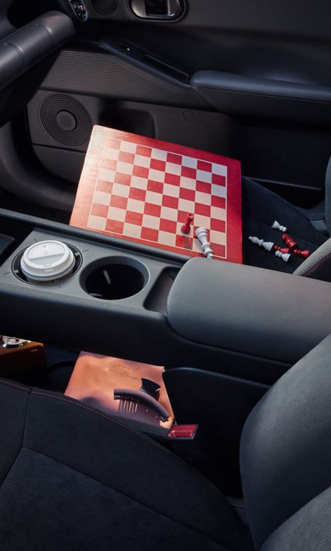 Hyundai IONIQ 3 interior centre console with a wooden chessboard between the front seats.