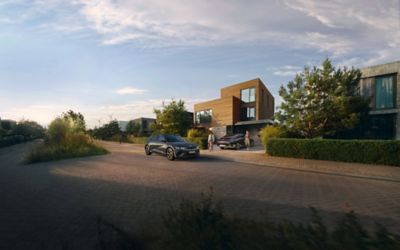 Hyundai IONIQ 5 and IONQ 6 parked outside a house. 