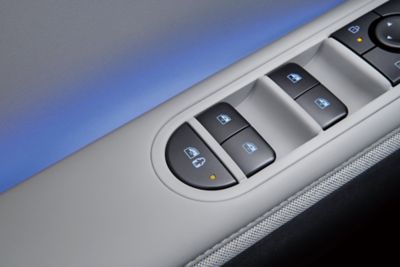 Safety Exit Assist button on the armrest of the Hyundai IONQ 5. 