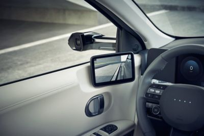 One of the video-based Digital Side Mirrors, inside the door to the left of the steering wheel.