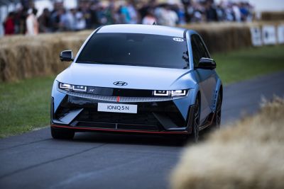 The all-electric Hyundai IONIQ 5 N driving through a curve.