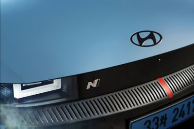 Close up view of the headlamp and N badge of the all-electric Hyundai IONIQ 5 N.