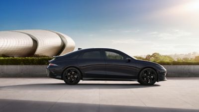 Hyundai IONIQ 6 Black package side view in front of a building.