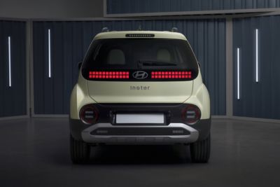 The Hyundai INSTER small electric car shown from the rear.
