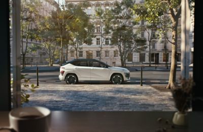 The side of the all-new Hyundai KONA Electric N Line with black roof.