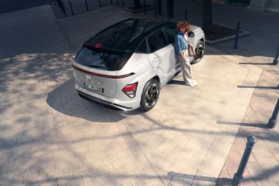 The all-new Hyundai KONA Electric N Line in Serenity White Pearl, parked outside.