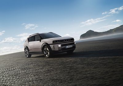 The all-new Hyundai NEXO hydrogen-powered SUV pictured from the front driving on a beach.