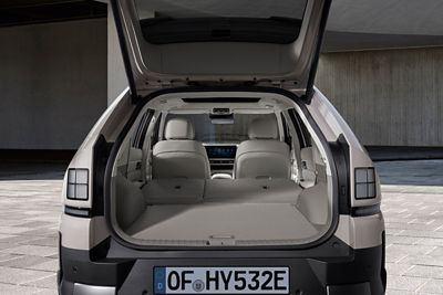 Rear view of a Hyundai NEXO with open trunk showing cargo space and back seats.