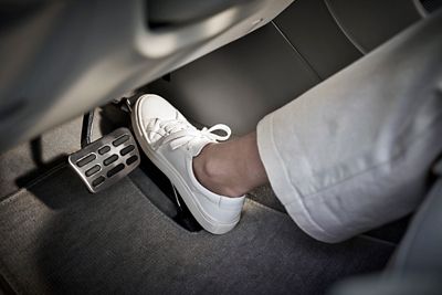 A close up image of a person's shoe pressing on the accelerator inside the Hyundai NEXO.	