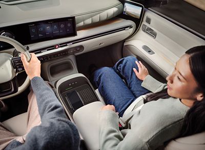 A woman in the front passenger seat on board the Hyundai NEXO.