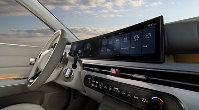 The cockpit of the Hyundai NEXO with Panoramic Curved Display and steering wheel.